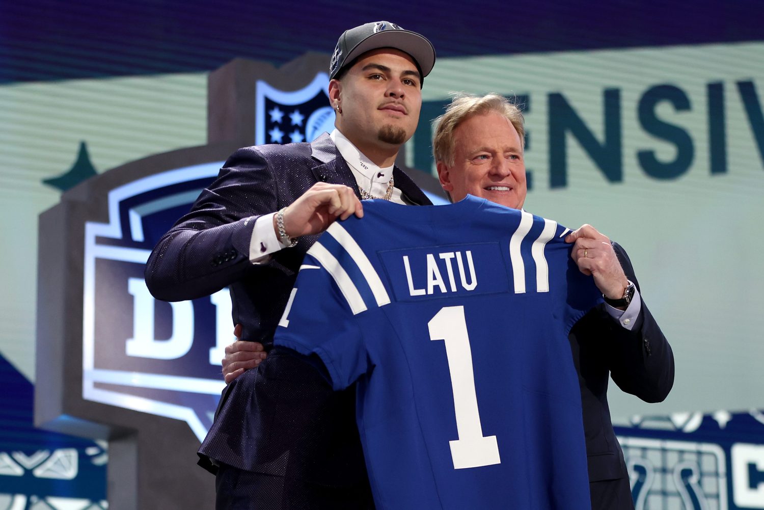 Laiatu Latu poses with NFL commissioner Roger Goodell.