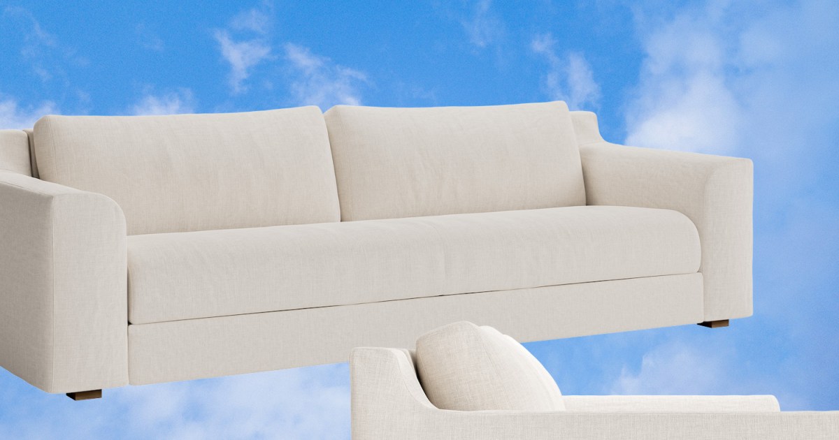 The Sabai Sleeper Sofa against a background of blue sky and clouds.