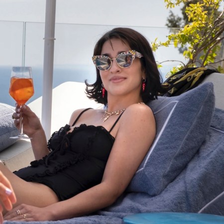 lucia from white lotus drinking an aperol spritz