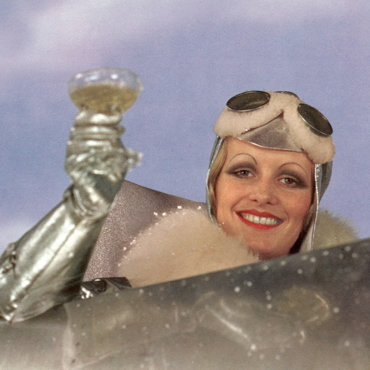 English model and actress Twiggy, as Polly Browne, raises a champagne glass in the cockpit of an aeroplane in a scene from the fim version of Sandy Wilson's musical 'The Boy Friend', directed by Ken Russell, 1971.