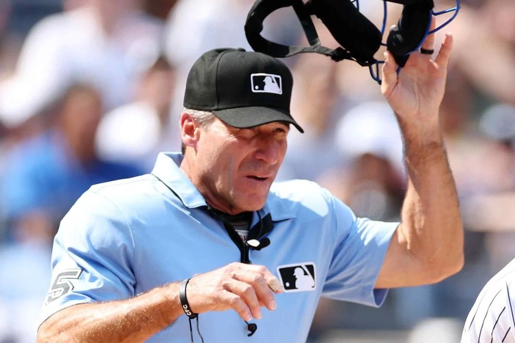 MLB umpire Angel Hernandez making a call. The controversial baseball ump retired this week at the age of 62.