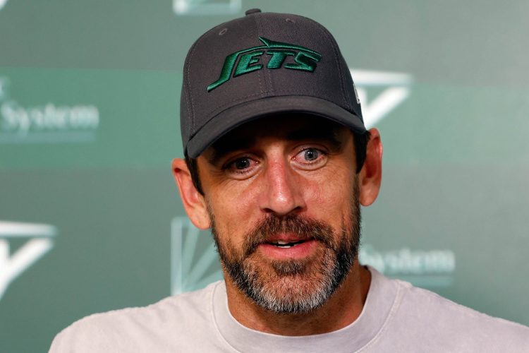 Aaron Rodgers speaks to the media at Jets' OTAs.