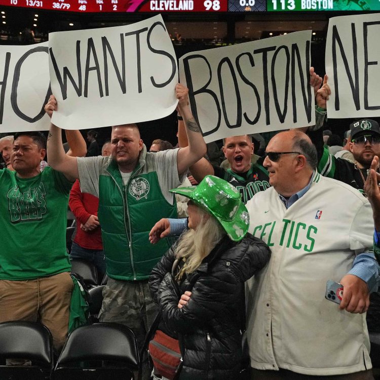 Boston Celtics fans celebrate during a game against the Cavaliers.