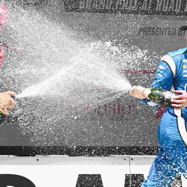 Marcus Ericsson and Josef Newgarden share the winners' podium.