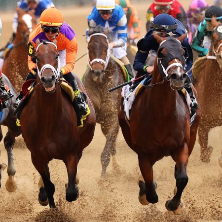 The field at the first turn at the 149th running of the Kentucky Derby.