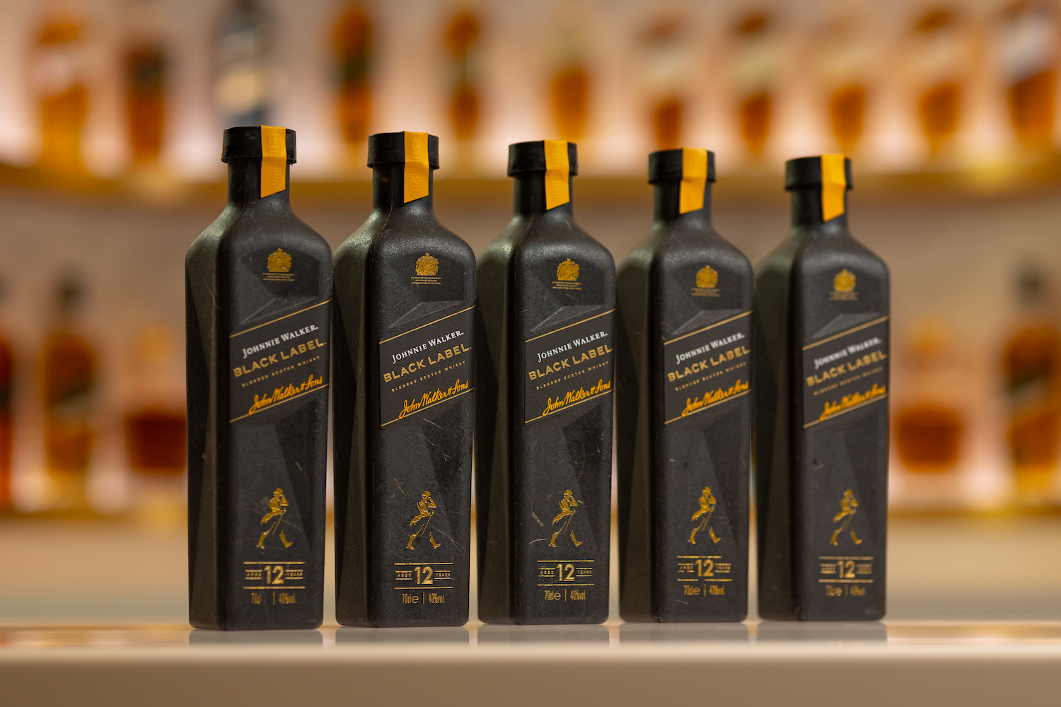 5 bottles of Johnnie Walker black label in paper bottles