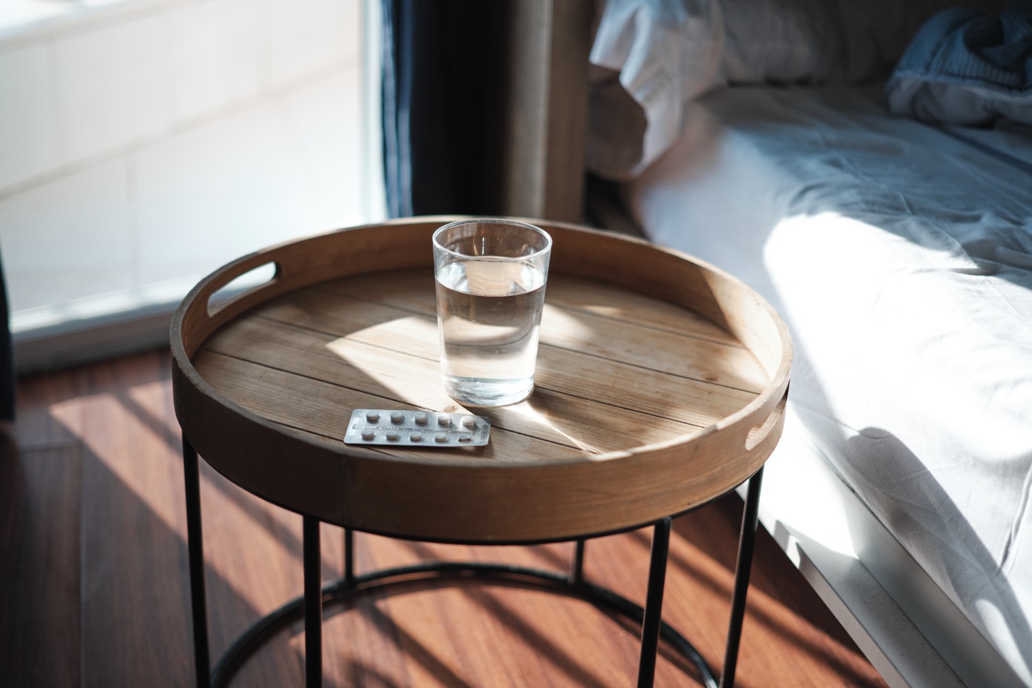 Pills and water on a table