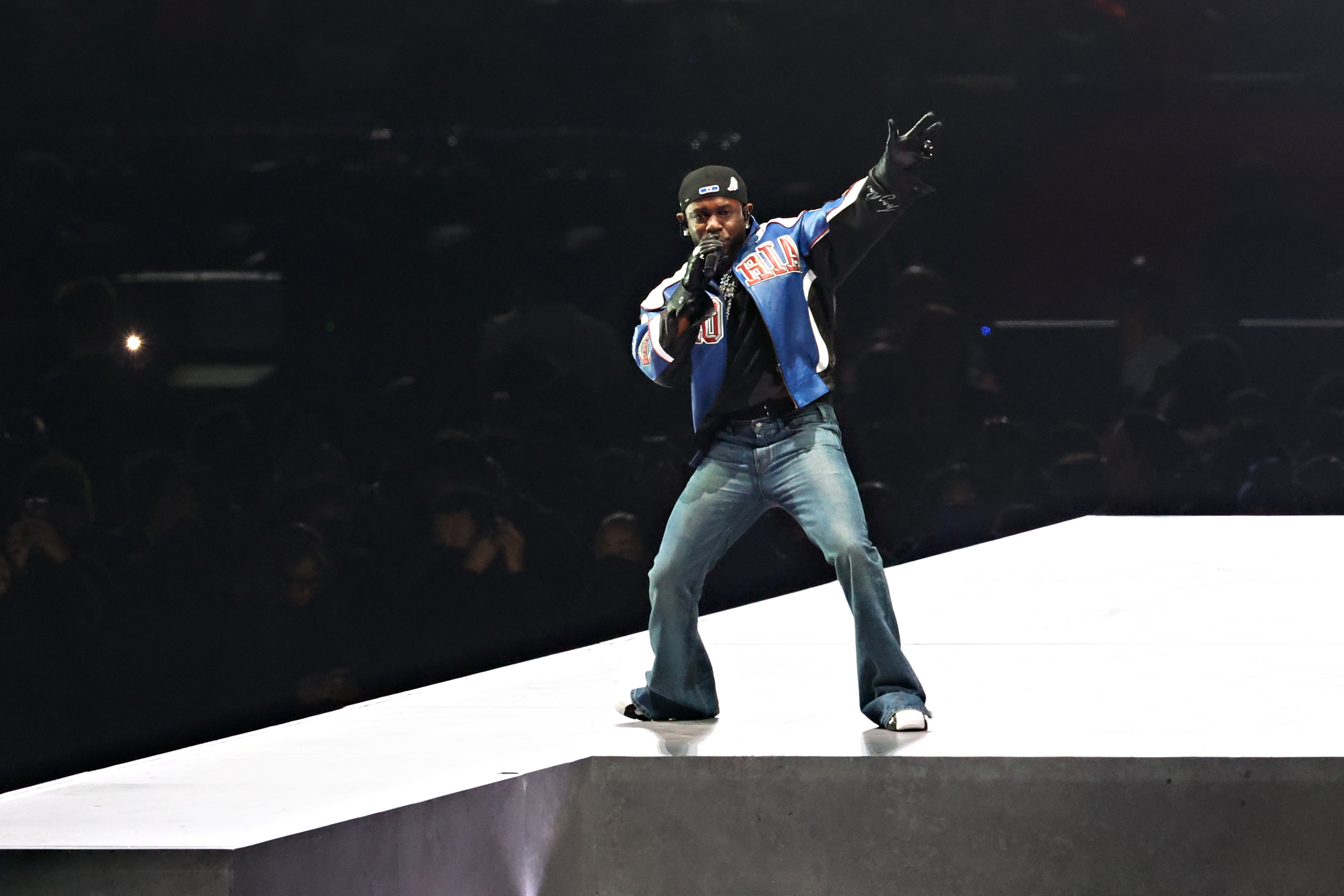 Kendrick Lamar performing in bootcut jeans during the Super Bowl LIX Halftime Show