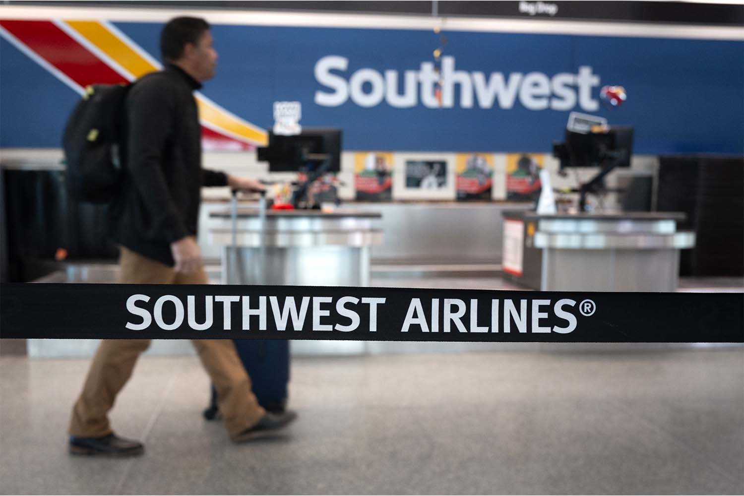 Passengers check in for Southwest Airlines flights at Chicago Midway International Airport on February 18, 2025 in Chicago, Illinois.