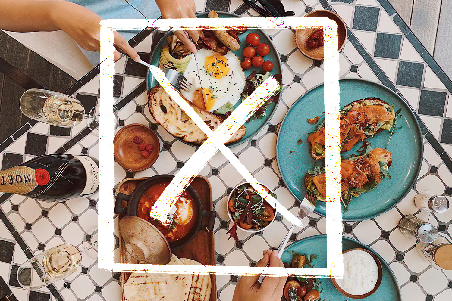 a picture of brunch on a black and white table with a white x over it