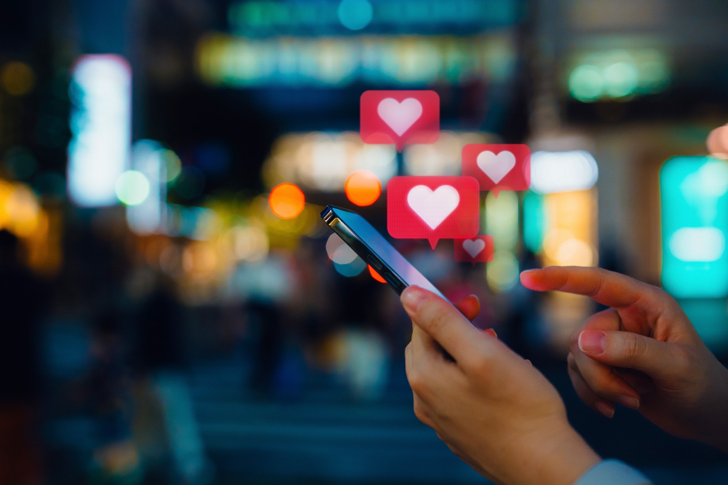 Smartphone user sending love emojis
