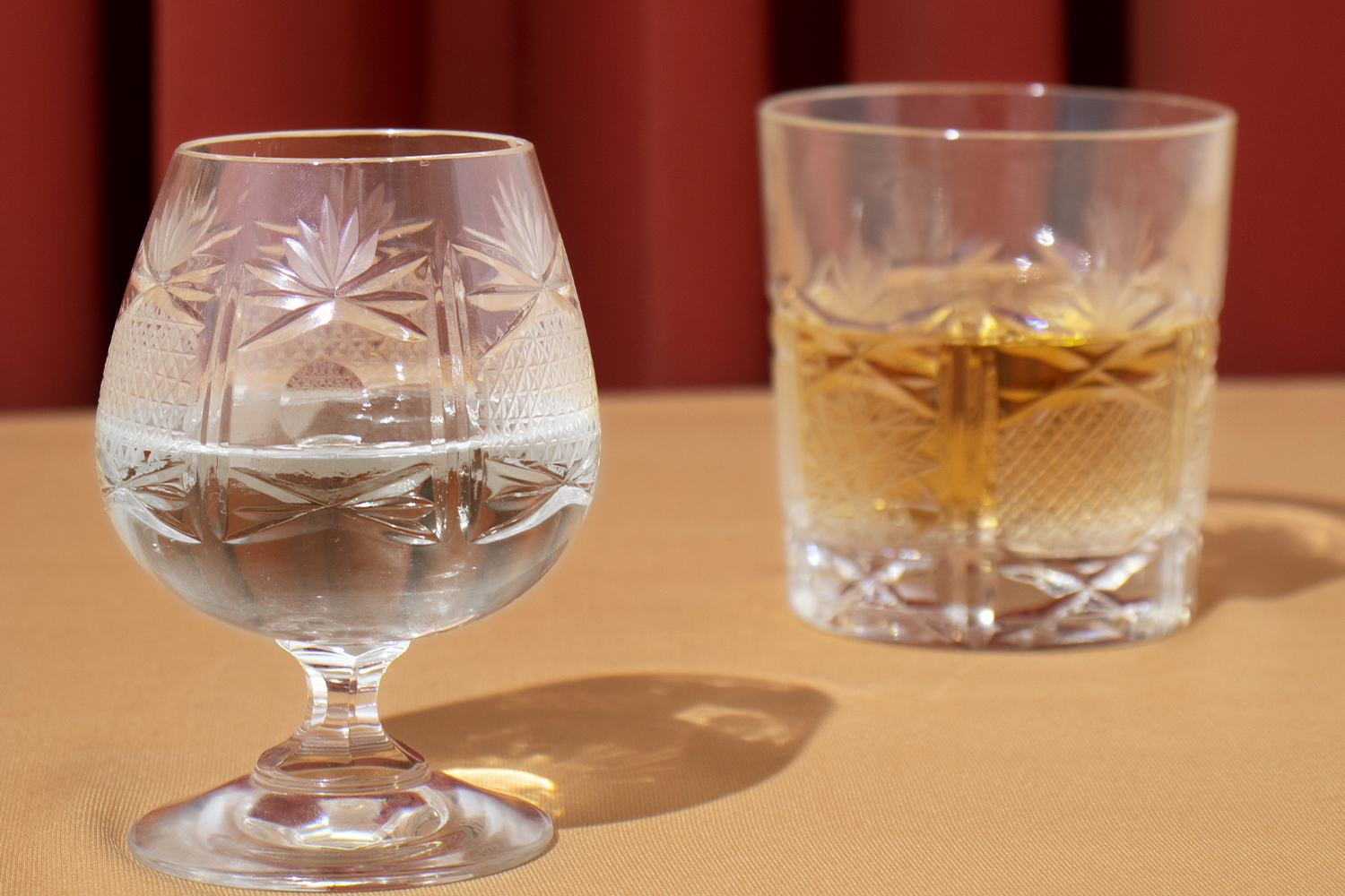 A water glass and a whiskey glass