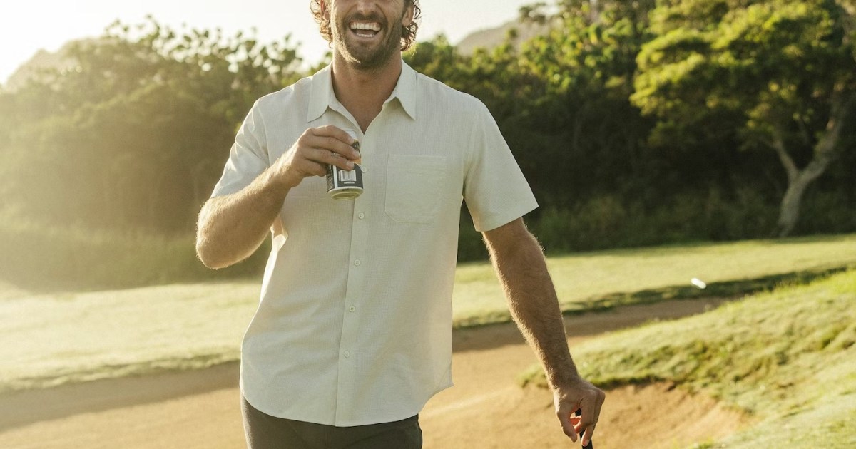 A model playing golf drinking a beer