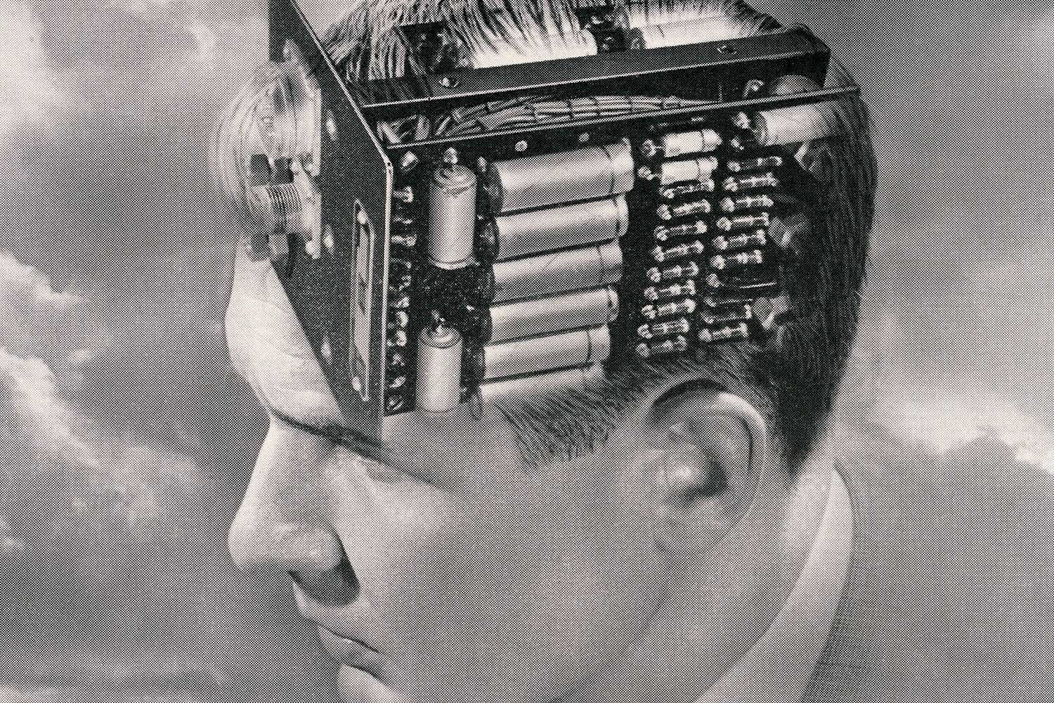 An illustration of a man's head with a circuit board attached