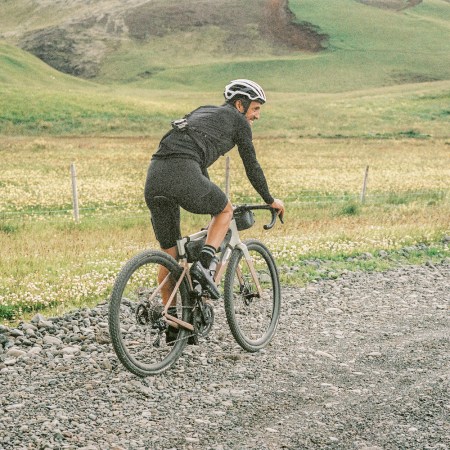 A man on a bike in nature.