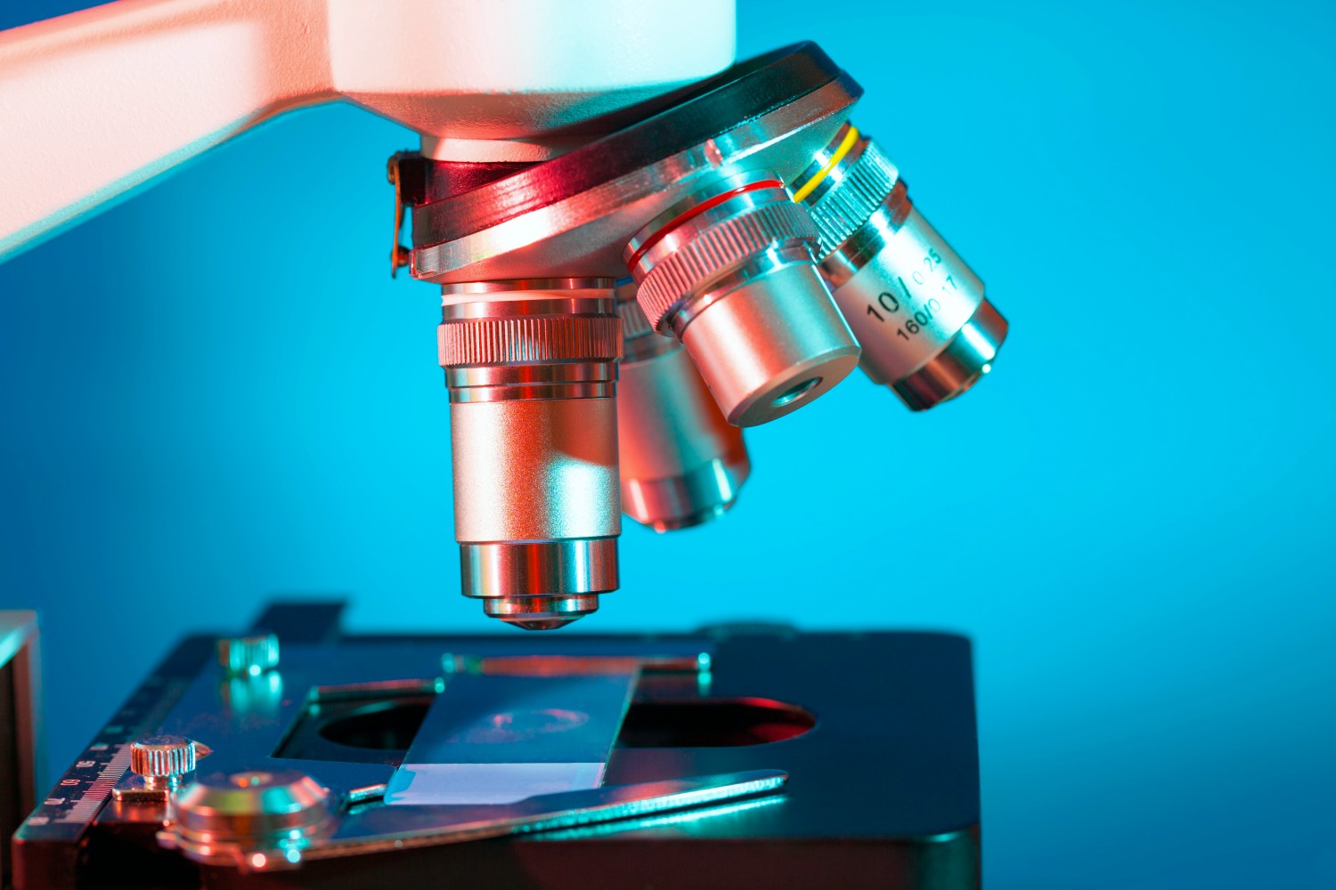 Microscope against a blue background