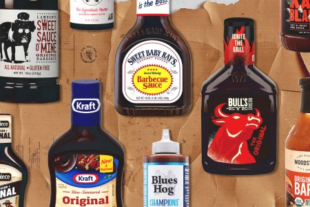 bottles of bbq sauce on a brown background