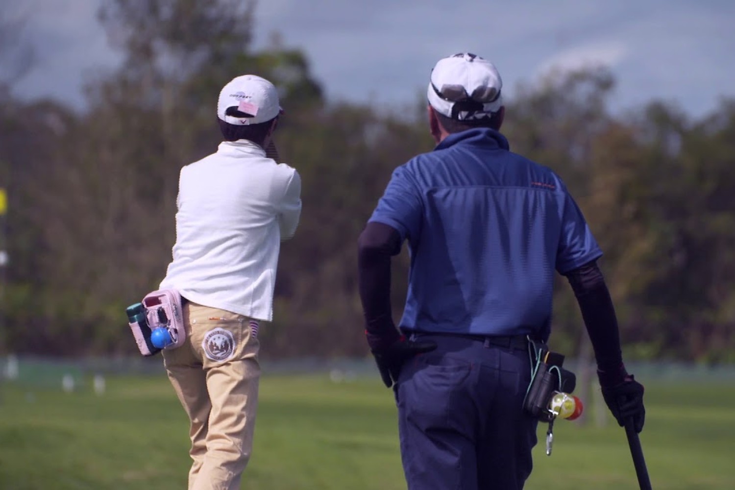 Two people playing park golf