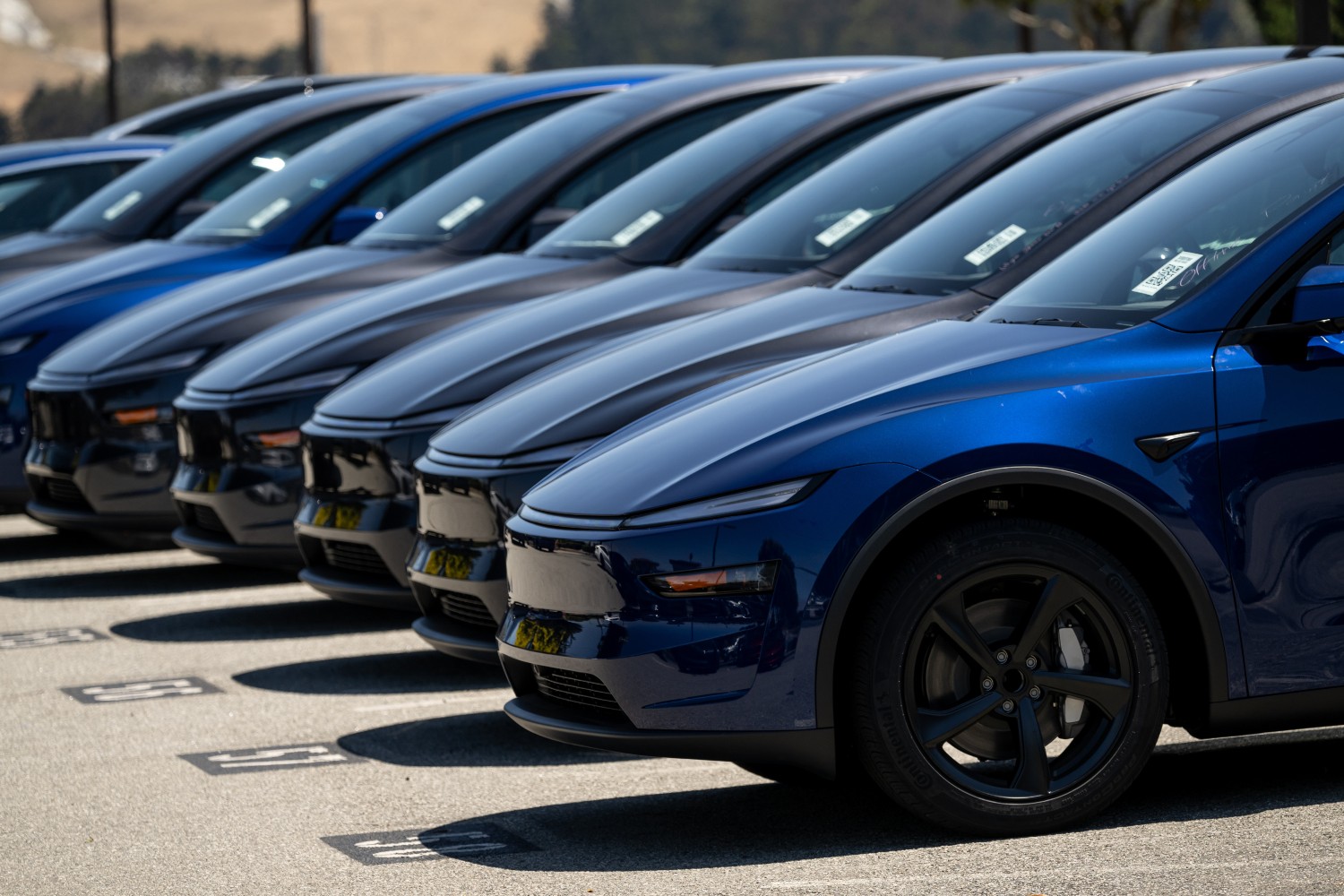 A row of Tesla Model Ys. A Tesla owner recently wrote a blog post about getting a refund through arbitration for the Full Self-Driving package.