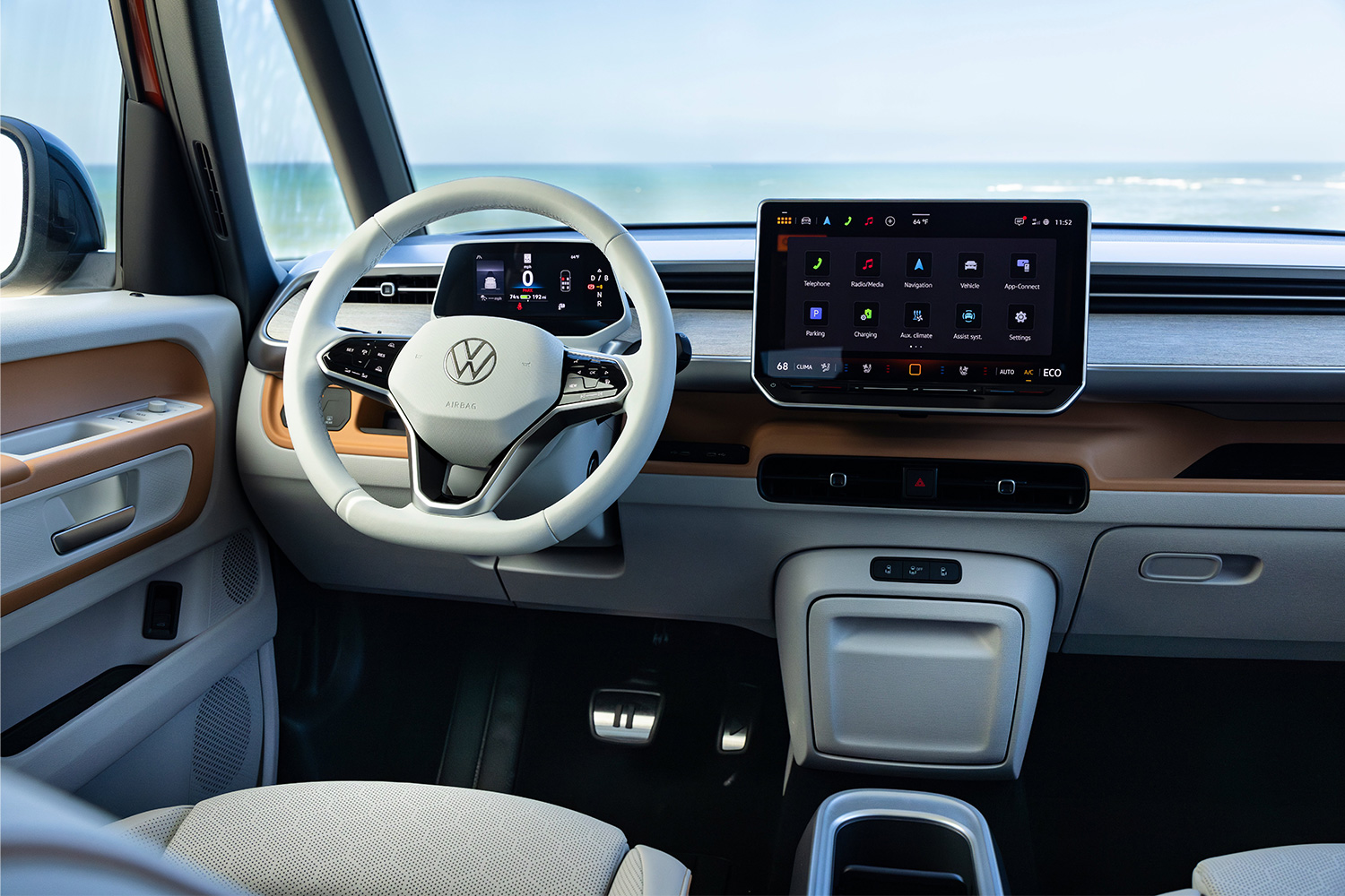 The gauge cluster screen, steering wheel and infotainment screen in the VW ID. Buzz