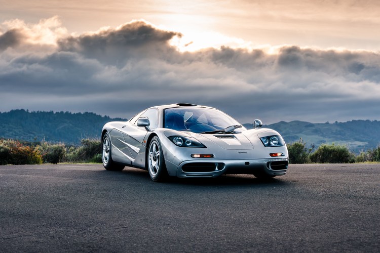 A 1997 McLaren F1 once owned by Larry Ellison sitting still with a setting sun in the background