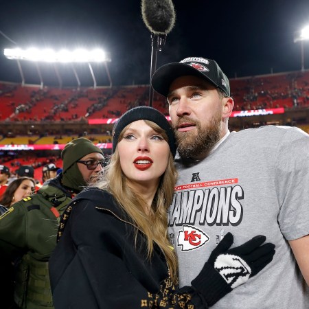 Taylor Swift celebrates with Travis Kelce #87 of the Kansas City Chiefs after defeating the Buffalo Bills 32-29 in the AFC Championship Game