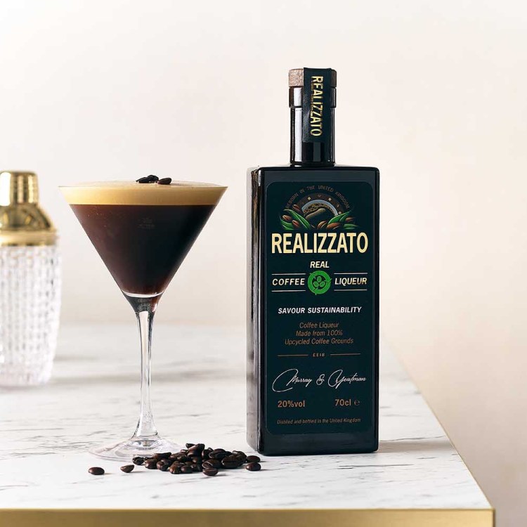 A bottle of Realizzato and an espresso martini on a table