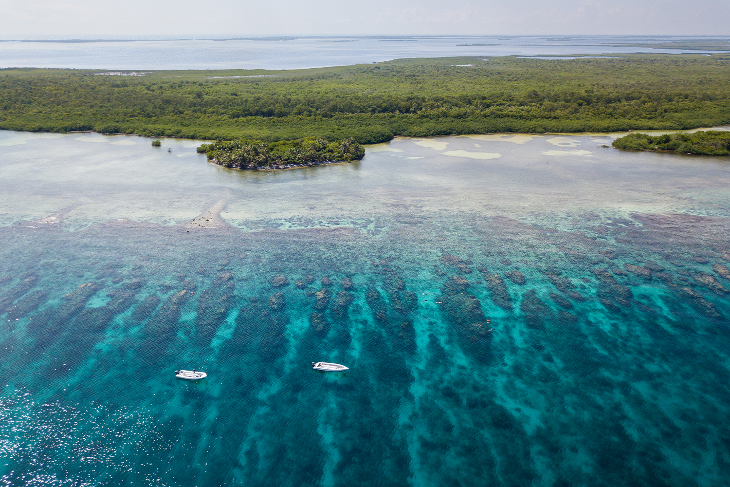 An aerial view of the barrier reef along Turneffe Atoll