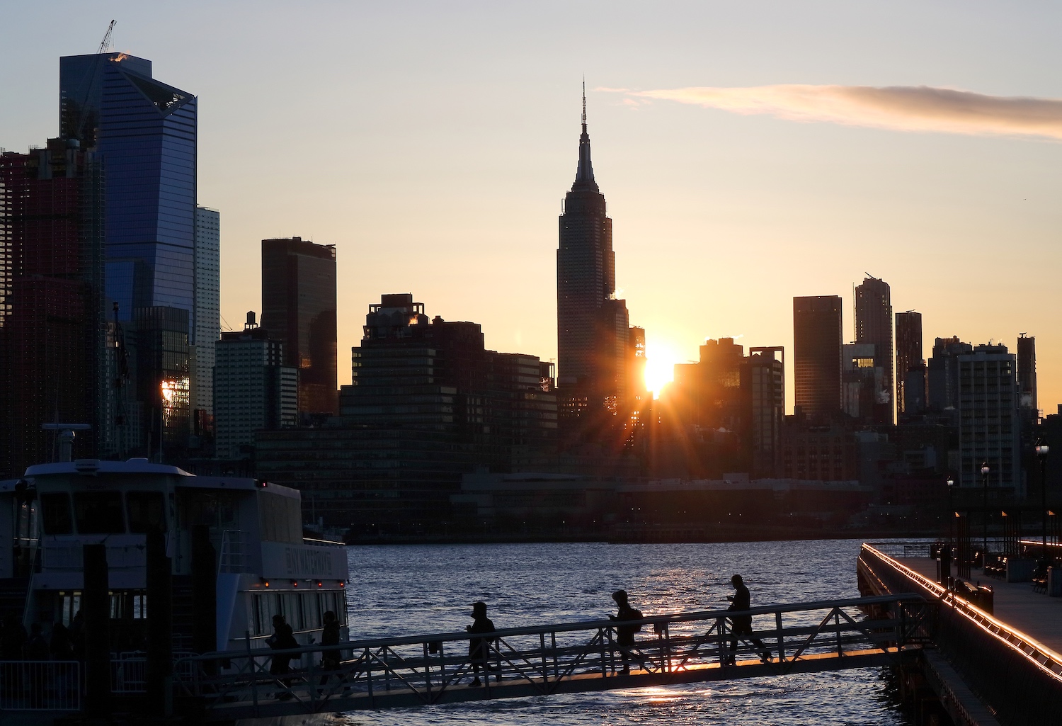 The sun rising over New York City. We discuss seven habits that can lead to a healthier workday.