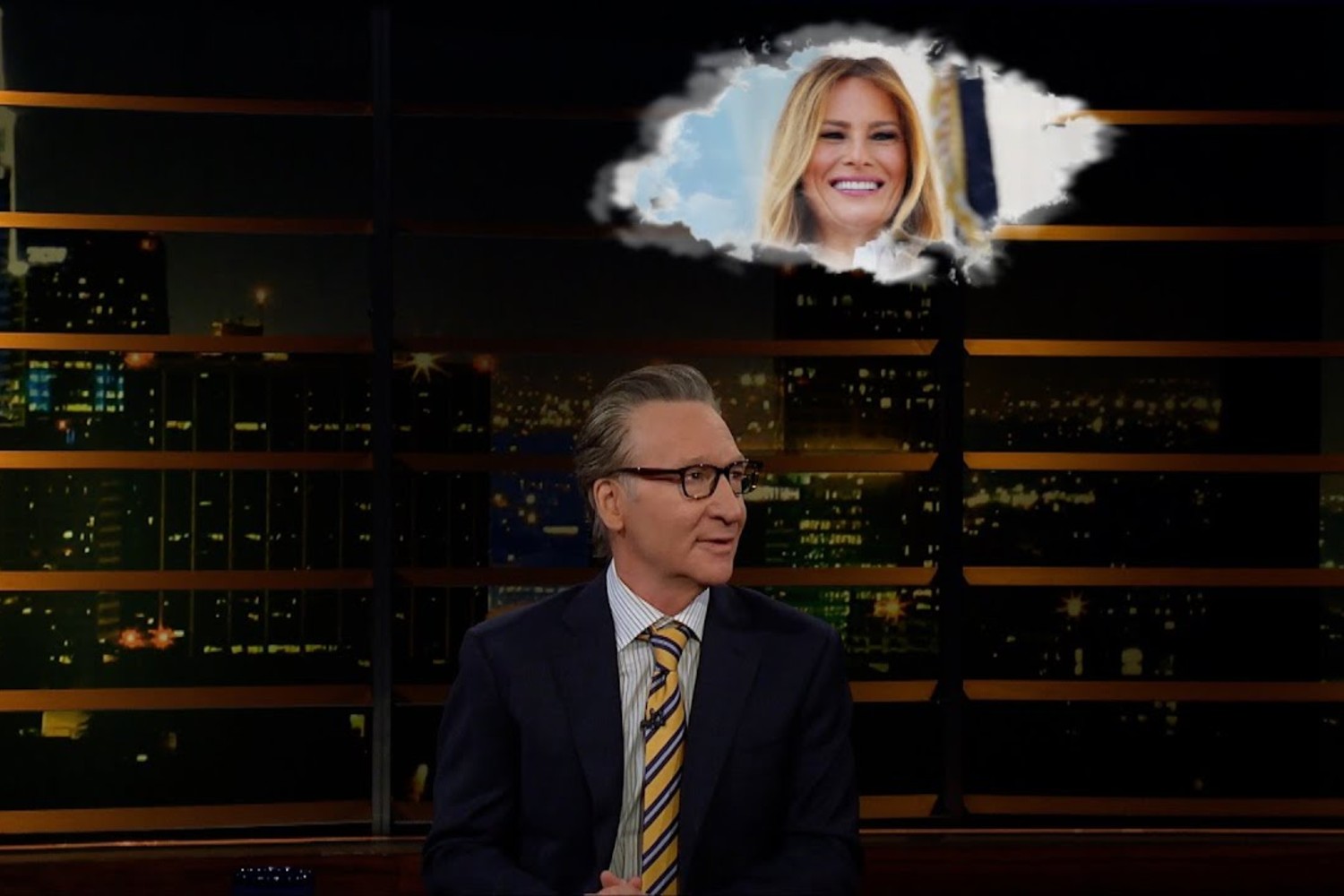 Bill Maher with a cloud above him