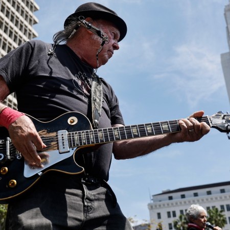 Neil Young playing guitar