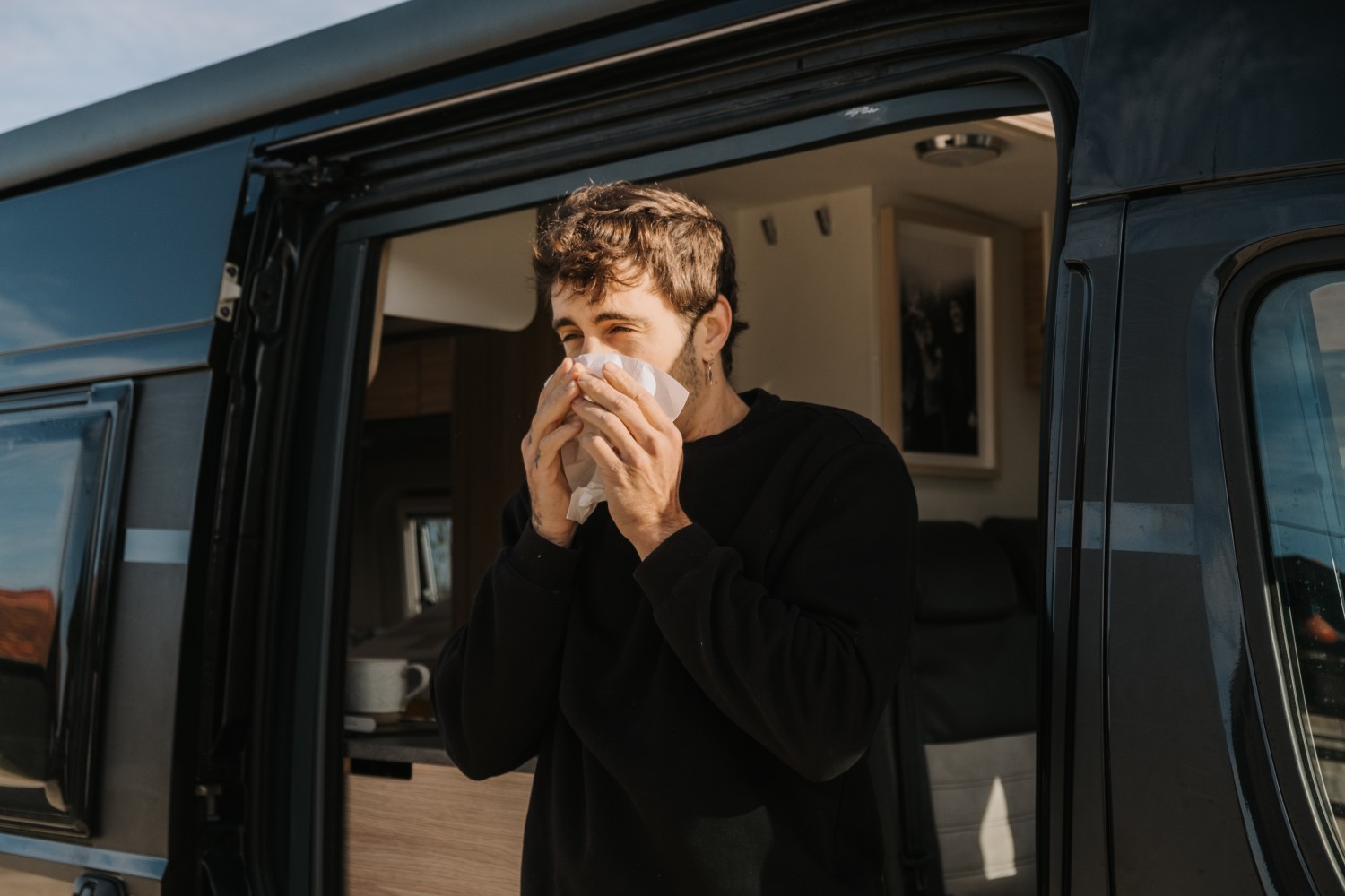 Sneezing man existing transit