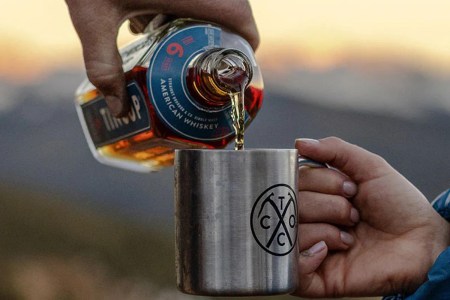 TINCUP 6 Year American Whiskey being poured into a TINCUP mug