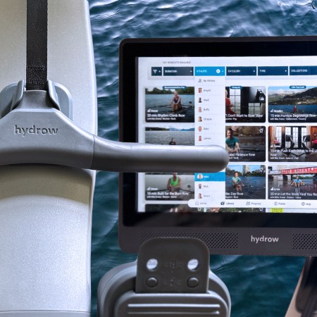 The handle on the Hydro Pro Rower [left] and the attached screen [right], with a background of water