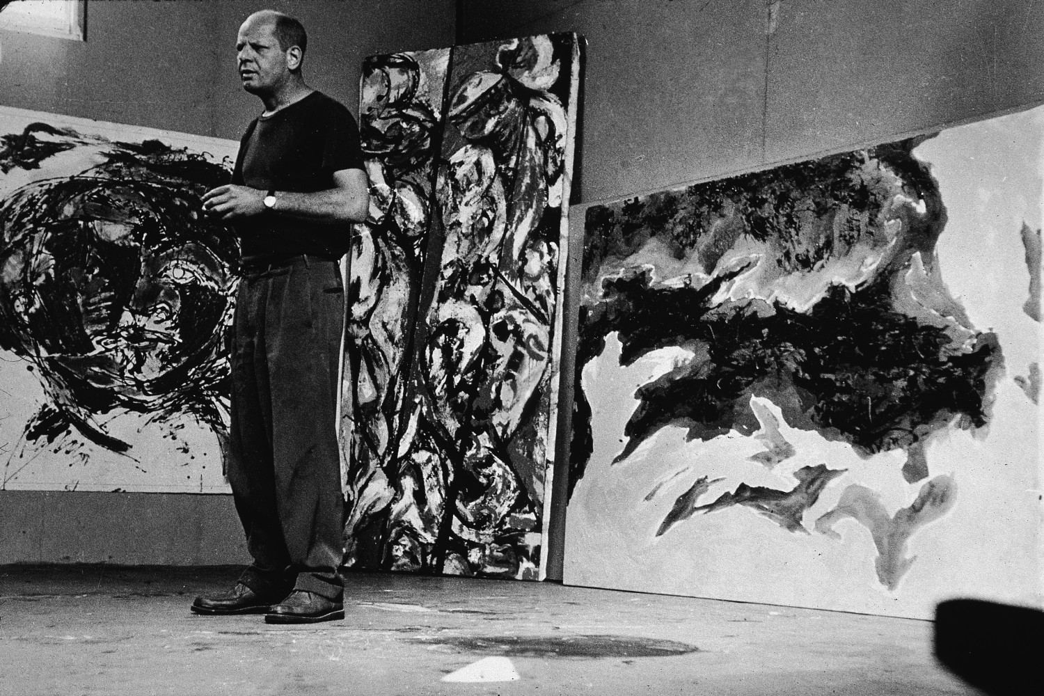 Jackson Pollock with paintings