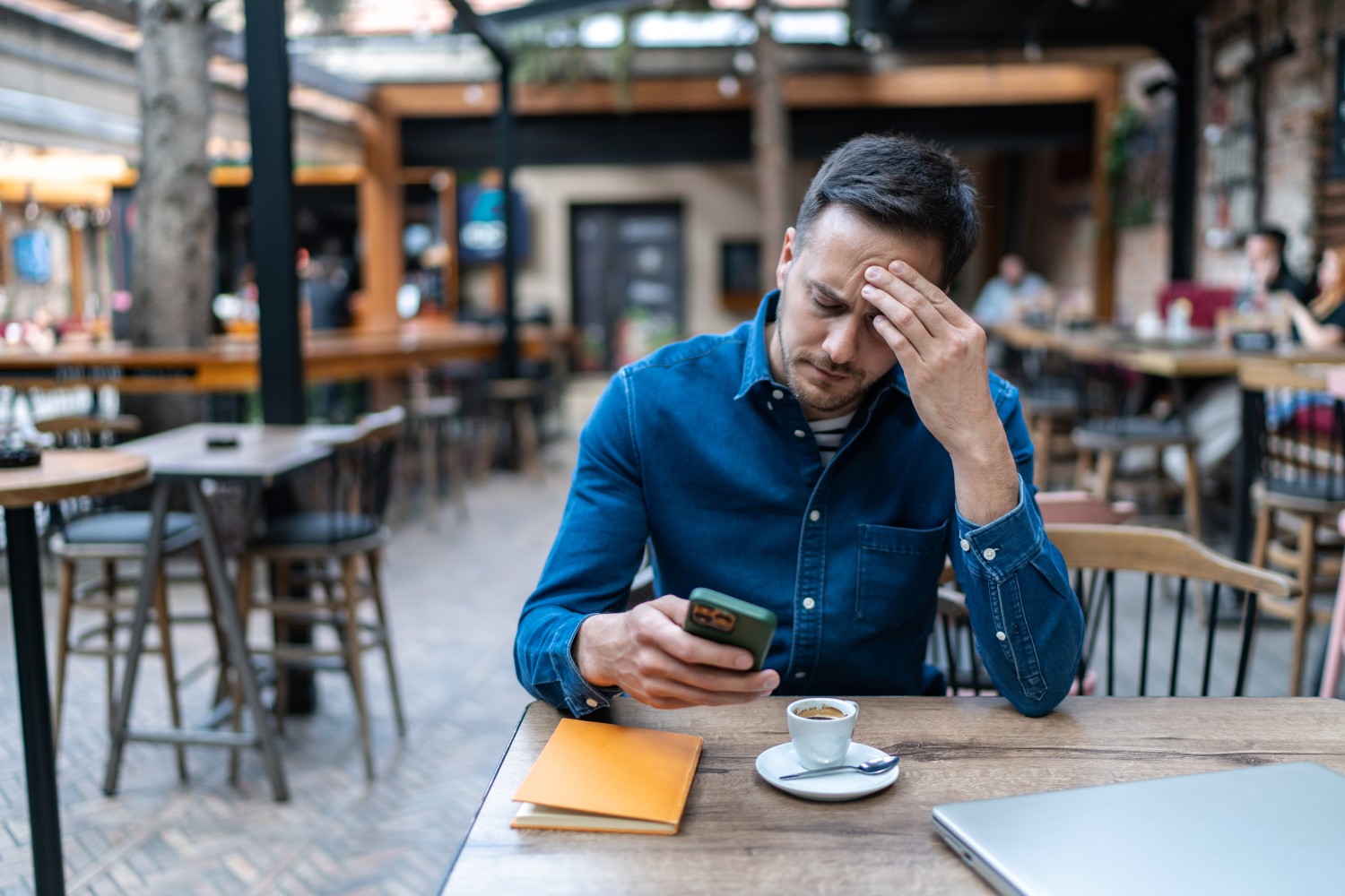 Frustrated man reading texts