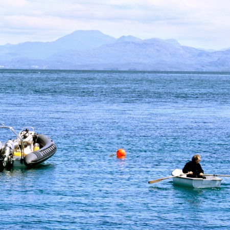 A man rowing off the coast of Scotland.