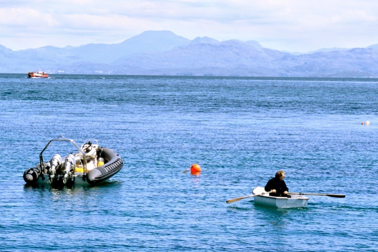 A man rowing off the coast of Scotland.