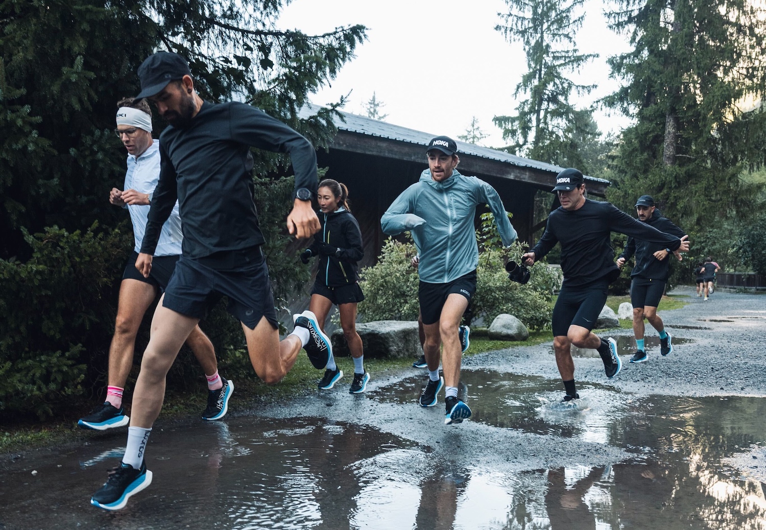 A view of runners on a wet trail in Chamonix.
