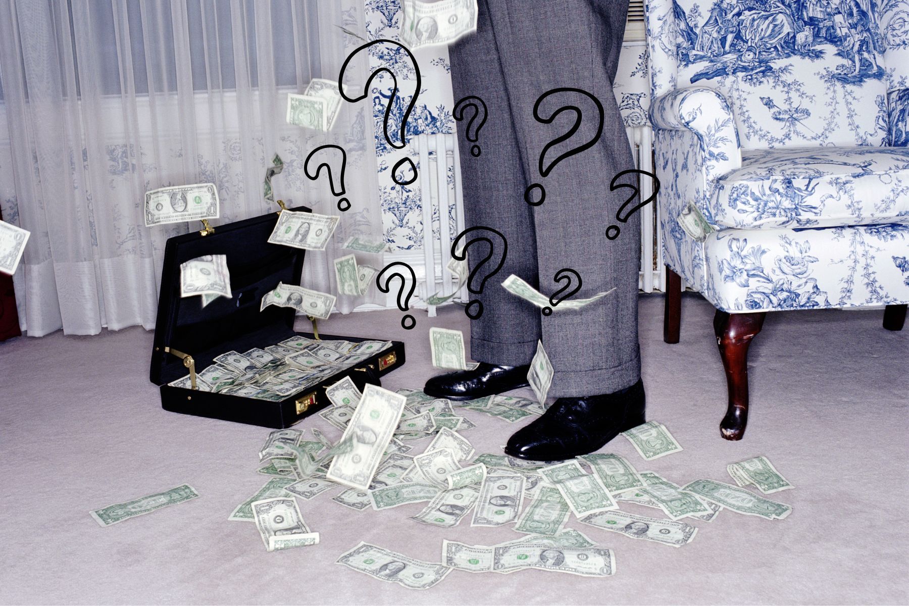 A man's feet with money on the floor