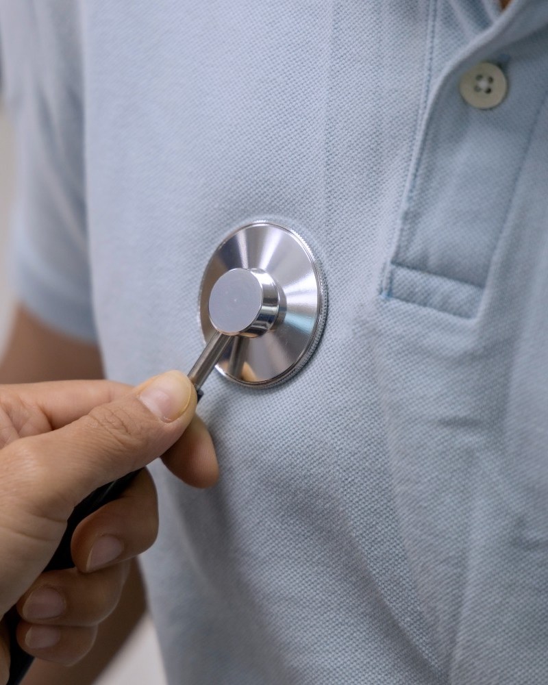 Doctor checking a patient's heartbeat