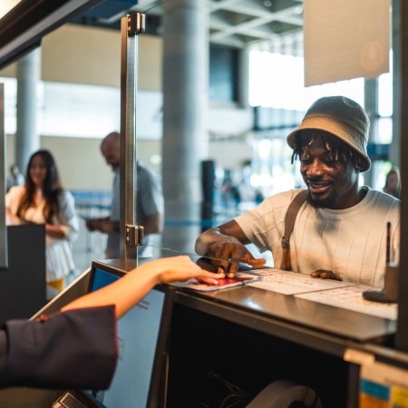 Man showing his passport while traveling