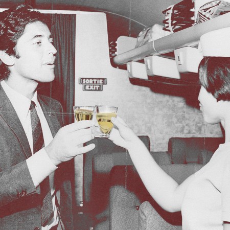 A man and a woman clinking glasses on a plane, vintage