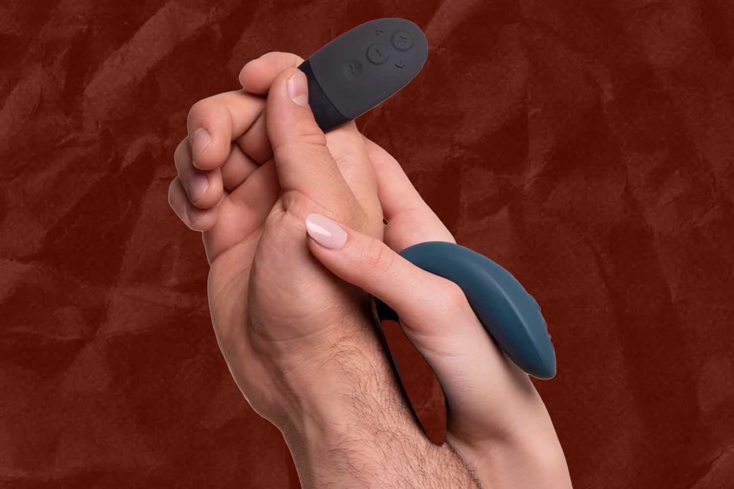 A man and woman holding the We-Vibe sync