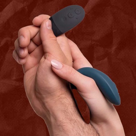A man and woman holding the We-Vibe sync