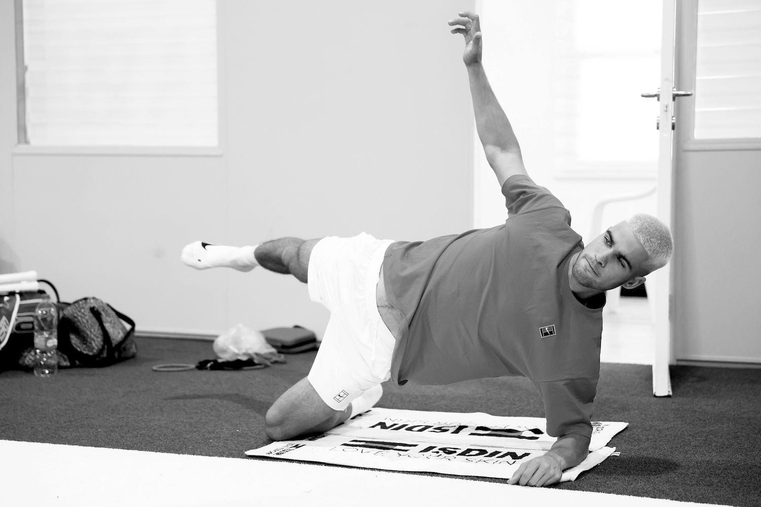 Carlos Alcaraz performing a modified plank, a move that can help with your posture alignment