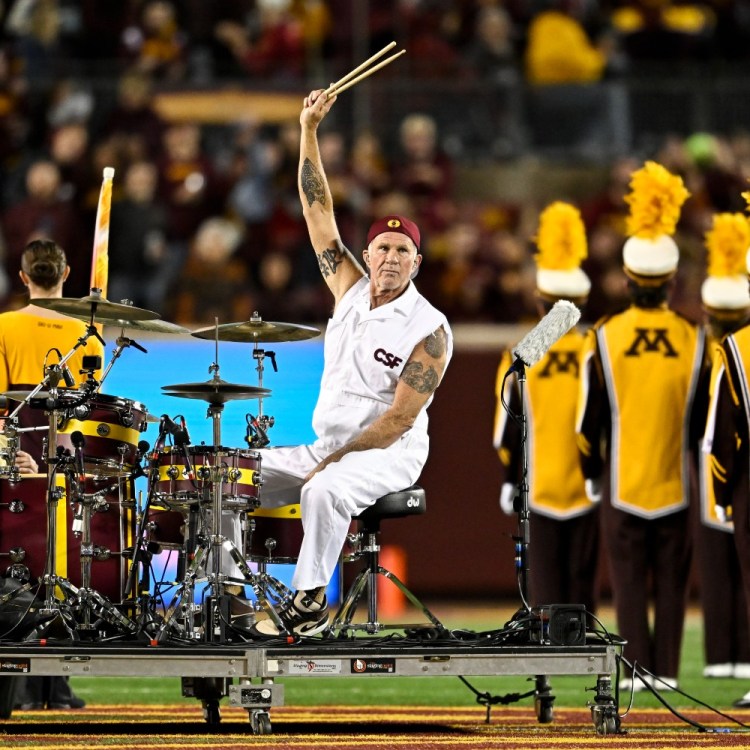 Chad Smith drumming at a football game