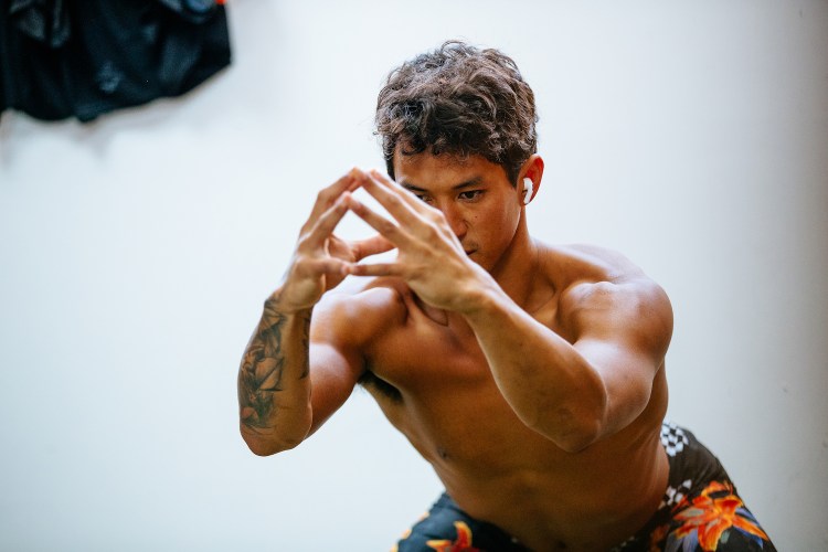 A man performing air squats.