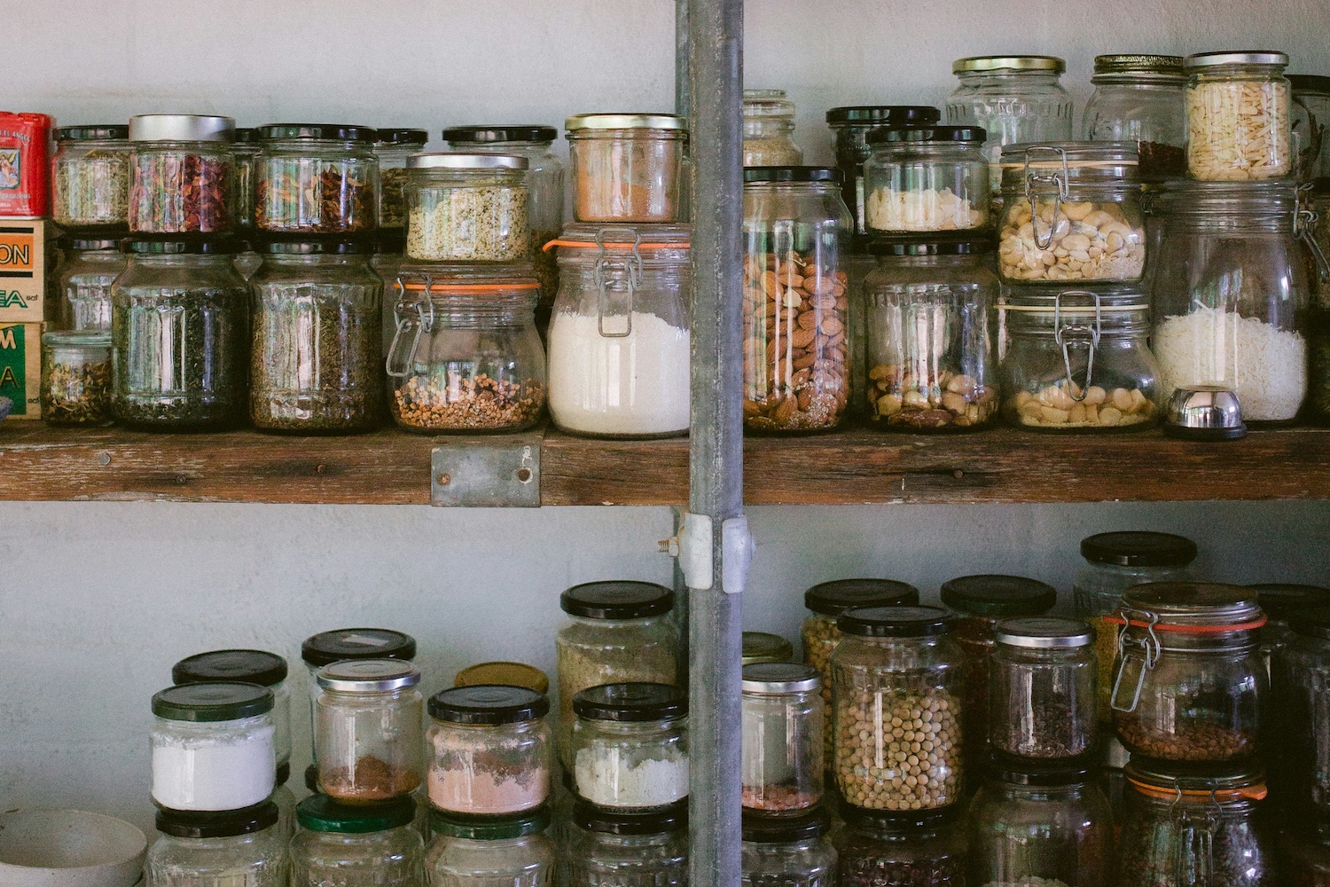 A row of jars on a shelf.