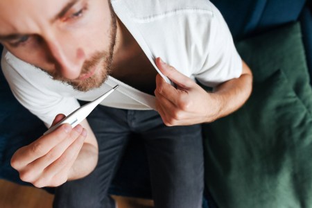 Man taking temperature